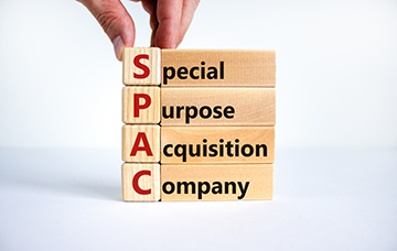 SPAC spelled in wooden blocks