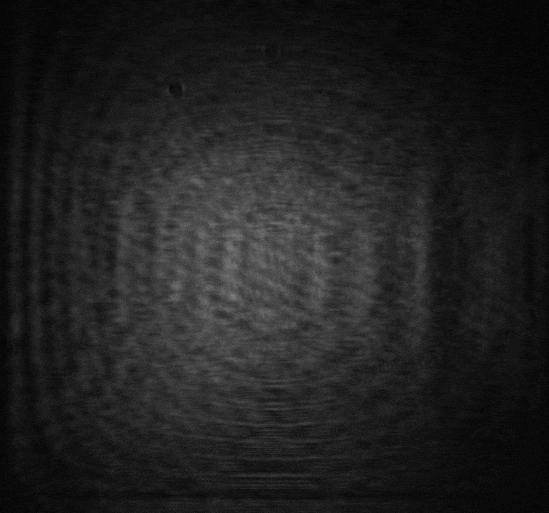 A gif of white light on a black background. As time passes, the white light turns into a pattern showing the University of Ottawa's logo.