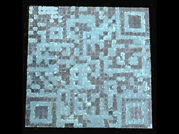 Photo of QR code made with chiral structural-color CLCs