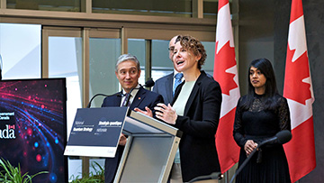 Simmons at government announcement event